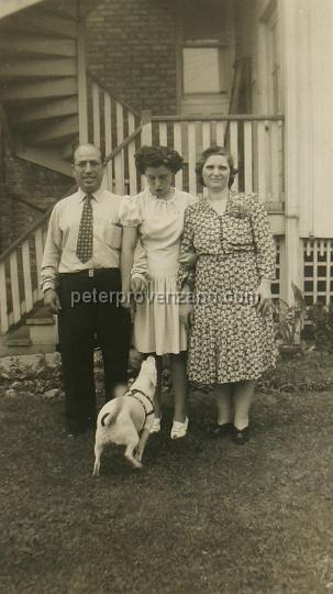 Peter Provenzano Photo Album Image_copy_194.jpg - From left to right: Vincent and Santina Provenzano with their youngest daughter Dominica (May) and Butchie (the dog). Taken at 
3128 North Mason Avenue, Chigago IL.